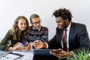 Perth tax agent holding his notes and explaining taxes to clients