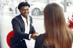 Tax agent in Perth smiling and shaking hands with a client